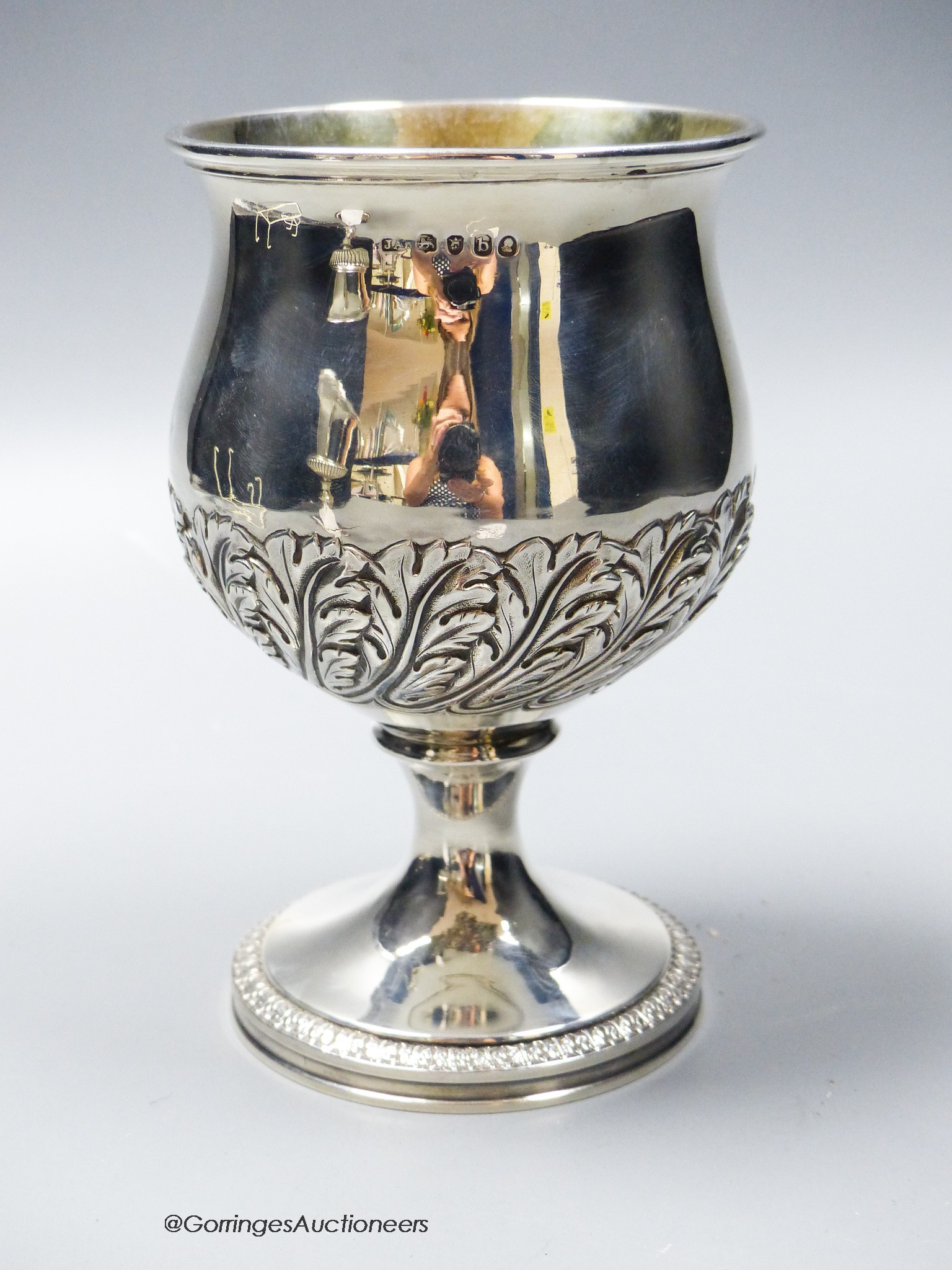 A George III silver goblet, embossed with band of oak leaves, Joseph Angell I, London, 1817, 14.7cm,9.5oz.
